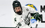 Michigan State's Eric Nilson hits the puck against Minnesota during the first period on Friday, Jan. 23, 2026, at Munn Ice Arena in East Lansing. - Nick King, USA TODAY Sports