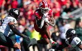 Wisconsin Badgers running back Darrion Dupree (6) rushes with the football between Michigan State Spartans defensive end Keahnist Thompson (9) and cornerback Charles Brantley (4) during the first quarter at Camp Randall Stadium. - Jeff Hanisch, USA TODAY Sports