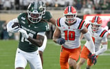 Michigan State Spartans wide receiver Bryson Williams (14) runs past Illinois Fighting Illini linebacker James Kreutz (10) during the fourth quarter at Spartan Stadium. - Dale Young, USA TODAY Sports