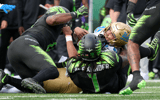 UCLA QB Nico Iamaleava tackled by Oregon DL Bear Alexander