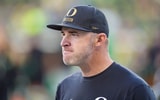 Oregon offensive coordinator Drew Mehringer walks the field before the game as the Oregon Ducks host the Portland State Vikings