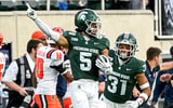 Michigan State’s Samson Gash celebrates after recovering an onside kick against Illinois during the fourth quarter on Saturday, Oct. 10, 2026, at Spartan Stadium in East Lansing. The play was reversed after an offside call. - Nick King, USA TODAY Sports