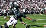 Michigan State’s Bryson Williams, right, catches a touchdown pass as Northwestern’s Montae Pate defends during the second quarter on Saturday, Oct. 17, 2026, at Spartan Stadium in East Lansing. (Nick King/Lansing State Journal / USA TODAY NETWORK via Imagn Images)
