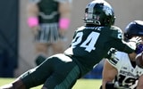 Oct 17, 2026; East Lansing, Michigan, USA; Northwestern Wildcats quarterback Sean Winton (15) catches a pass while defended by Michigan State Spartans defensive back Jeremiah Favorite (24) in the third quarter at Spartan Stadium.(Credit: Dale Young-Imagn Images)