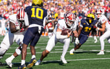 Indiana quarterback Josh Hoover (10) runs for a touchdown against Michigan during overtime at Michigan Stadium in Ann Arbor on