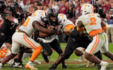 Oct 24, 2026; Columbia, South Carolina, USA;  South Carolina Gamecocks quarterback LaNorris Sellers (16) is tackled by Tennessee Volunteers defensive back Jadais Richard (8) during the second half at Williams-Brice Stadium.  Mandatory Credit: Jim Dedmon-Imagn Images