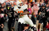 Tennessee running back DeSean Bishop (18) escapes tackles as he runs with the ball during a college football game between Tennessee and South Carolina at Williams-Brice Stadium in Columbia, S.C., on Oct. 24, 2026.