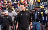 Indiana head coach Curt Cignetti walks onto the field for warmup ahead of the game between Michigan and Indiana at Michigan