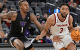 LAS VEGAS, NEVADA - MARCH 10: Isaiah Mobley #3 of the USC Trojans drives against Nate Roberts #1 of the Washington Huskies during the Pac-12 Conference basketball tournament quarterfinals at T-Mobile Arena on March 10, 2022 in Las Vegas, Nevada. 