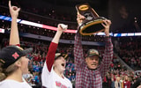 Nebraska head coach John Cook hoisting the 2017 National Championship trophy (Photo by Jamie Schwaberow/NCAA Photos via Getty Images)
