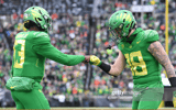 EUGENE, OR - NOVEMBER 27: Oregon Ducks QB Anthony Brown (13) celebrates a touchdown run with Oregon Ducks TE Spencer Webb (18) during a PAC-12 conference football game between the Oregon State Beavers and Oregon Ducks on November 27, 2021 at Autzen Stadiu