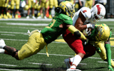 EUGENE, OREGON - SEPTEMBER 04: Linebacker Justin Flowe #10 and cornerback Dontae Manning #8 of the Oregon Ducks bring down wide receiver Ty Jones #8 of the Fresno State Bulldogs during the third quarter of the game at Autzen Stadium on September 04, 2021 