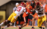 Wide receiver Tre'Shaun Harrison #0 of the Oregon State Beavers gets tackled by defensive back Jaylin Smith #19 and linebacker Shane Lee #53 of the USC Trojans at Reser Stadium on September 24, 2022 in Corvallis, Oregon. (Photo by Ali Gradischer/Getty Ima