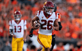 Running back Travis Dye #26 of the USC Trojans rushes the ball against the Oregon State Beavers at Reser Stadium on September 24, 2022 in Corvallis, Oregon. (Photo by Ali Gradischer/Getty Images)