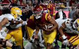 USC running back Travis Dye scores a touchdown against Arizona State in the fourth quarter at the Los Angeles Memorial Coliseum on Saturday night, Oct. 1, 2022. (Luis Sinco / Los Angeles Times via Getty Images)