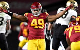 Defensive lineman Tuli Tuipulotu #49 of the USC Trojans reacts after blocking a pass against the Colorado Buffaloes in the first half of a NCAA football game at the Los Angeles Memorial Coliseum in Los Angeles on Friday, November 11, 2022. (Photo by Keith