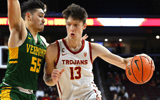 Drew Peterson #13 of the USC Trojans is defended by Robin Duncan #55 of the Vermont Catamounts as he drives to the basket in the first half at Galen Center on November 15, 2022 in Los Angeles, California. (Photo by Jayne Kamin-Oncea/Getty Images)