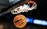 A basketball goes through the net during the 2023 NCAA Tournament