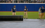 Tarp on the field during the Women's College World Series WCWS