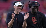 USC Trojans head coach Lincoln Riley and wide receivers coach Dennis Simmons