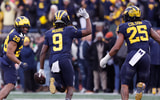 Nov 25, 2023; Ann Arbor, Michigan, USA; Michigan Wolverines defensive back Rod Moore (9) celebrates after he makes an interception in the second half against the Ohio State Buckeyes at Michigan Stadium. Mandatory Credit: Rick Osentoski-USA TODAY Sports