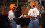 Tennessee baseball players celebrate after scoring a run. Credit: Tennessee Athletics