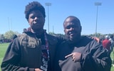 2026 OL Zyon Guiles out of Carvers Bay (SC) is pictured with Gamecocks OL coach Lonnie Teasley during a visit to South Carolina (Photo: Zyon Guiles | X)