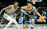 Michigan State guard Jaden Akins (3) dribbles against Mississippi State guard Shawn Jones Jr. (5) during the first half of NCAA tournament West Region first round at Spectrum Center in Charlotte, N.C. - Junfu Han, USA TODAY Sports