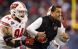 Dec 27, 2022; Phoenix, Arizona, USA; Wisconsin Badgers defensive end Gio Paez (94) with head coach Luke Fickell against the Oklahoma State Cowboys in the 2022 Guaranteed Rate Bowl at Chase Field. Mandatory Credit: Mark J. Rebilas-USA TODAY Sports