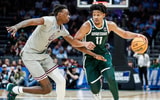 Michigan State guard A.J. Hoggard (11) dribbles against Mississippi State forward KeShawn Murphy (12) during the second half of NCAA tournament West Region first round at Spectrum Center in Charlotte, N.C. - Junfu Han, USA TODAY Sports