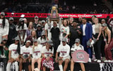 South Carolina Gamecocks head coach Dawn Staley celebrates with the trophy after defeating the Iowa Hawkeyes in the finals of the Final Four of the womens 2024 NCAA Tournament at Rocket Mortgage FieldHouse. Mandatory Credit: Kirby Lee-USA TODAY Sports