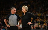 Coach Lisa Bluder speaks with an official during their game against Loyola-Chicago. (Photo by Kyle Huesmann)