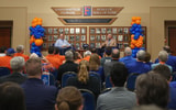 Gators play-by-play voice Sean Kelley and head football coach Billy Napier hold a conversation Monday night at Ben Hill Griffin Stadium as part of the Gators Caravan spring tour. (Photo: Maddie Washburn/UAA Communications)