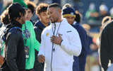 Notre Dame coach Marcus Freeman (center) talks to recruits before a game during the 2023 season. (Chad Weaver/Blue & Gold)