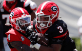 Michigan State and former Georgia running back Andrew Paul (3) throws a stiff-arm block on Georgia defensive back JK Bolden (4) during the G-Day spring football game in Athens, Ga., on Saturday, April 13, 2024 - Joshua L. Jones, USA TODAY Sports