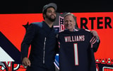 USC Trojans quarterback Caleb Williams poses with NFL commissioner Roger Goodell after being selected by the Chicago Bears as the No. 1 pick in the first round of the 2024 NFL Draft at Campus Martius Park and Hart Plaza