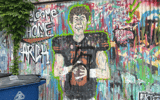 A since painted-over mural of Arch Manning on Austin's east side