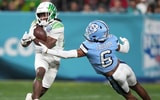 Oregon Ducks running back Noah Whittington (22) carries the ball against Michigan State and former North Carolina Tar Heels defensive back Lejond Cavazos (6) during the first half of the 2022 Holiday Bowl at Petco Park. - Kirby Lee, USA TODAY Sports