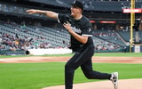 Saint Louis center Robbie Avila throws the first pitch at a Chicago White Sox game