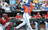 Jun 17, 2024; Omaha, NE, USA; Florida Gators starting pitcherdesignated hitter Jac Caglianone (14) hits a three run home run against the NC State Wolfpack during the second inning at Charles Schwab Field Omaha. Mandatory Credit: Steven Branscombe-USA TODAY Sports