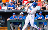 Jun 19, 2024; Omaha, NE, USA; Florida Gators first baseman Jac Caglianone (14) hits a home run against the Kentucky Wildcats during the sixth inning at Charles Schwab Field Omaha. The 75th home run of his career, Caglianone breaks the Florida all-time home run record previously held by Matt LaPorta. Mandatory Credit: Dylan Widger-USA TODAY Sports