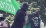 Jaylen Brown holds up Terrence Clarke jersey at the Boston Celtics championship parade  Screenshot: