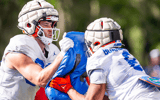 Florida Gators tight end Hayden Hansen (89) uses a tackling pad as fellow Gator Florida Gators tight end Arlis Boardingham (8) hits the pad during University of Florida Gators’ Spring football practice at Sanders Practice Fields in Gainesville, FL on Thursday, March 28, 2024. [Doug Engle/Gainesville Sun]