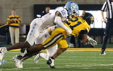 Greg Smith makes a tackle against Cal.