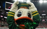 oregon-ducks-mascot-climbs-outside-fence-at-spartan-stadium