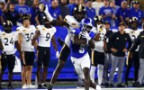 Aug 31, 2024; Lexington, Kentucky, USA; Kentucky Wildcats wide receiver Ja'Mori Maclin (9) catches a pass gaining 46 yards against Southern Miss Golden Eagles cornerback Micheal Caraway Jr. (2) during the third quarter at Kroger Field. Mandatory Credit: Carter Skaggs-USA TODAY Sports