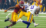 USC defensive back Jaylin Smith prepares to make a tackle against LSU's Zavion Thomas