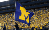 Michigan Maize Out tunnel The Big House crowd flag