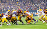 USC running back Woody Marks breaks through the LSU defensive line on his way to a touchdown for the Trojans