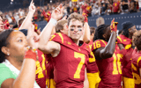 USC quarterback Miller Moss and his Trojans teammates celebrate following a win against the LSU Tigers
